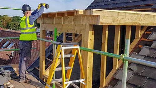 NVQ Level 3 carpenter and joiner assembling roof structure